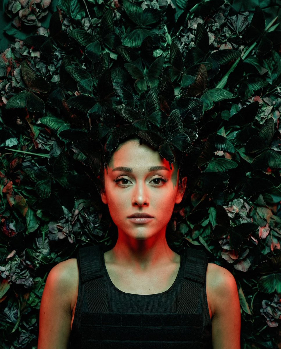 { "vibe_title_en": "Chrysalis of Conflict", "master_prompt": "一幅超写实的俯拍平铺肖像照,主角(The Protag…